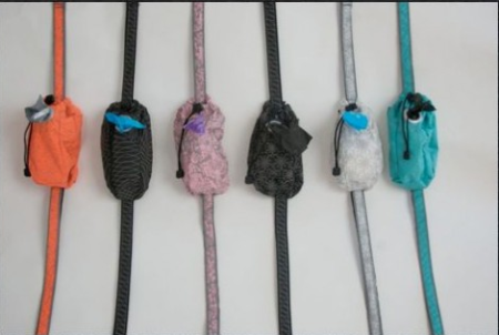 A row of different colored cord with various types of cords.