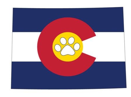 A flag of colorado with a paw print on it.