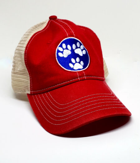 A red hat with the paw print of a dog on it.