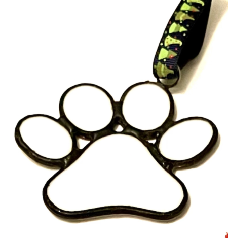 A paw print with a black and white strap.