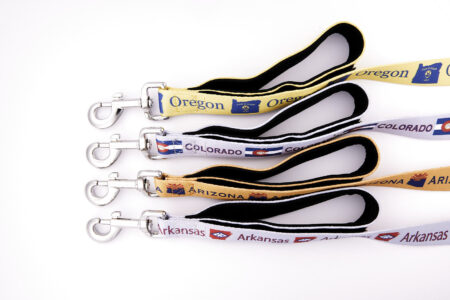 A group of five different colored lanyards.