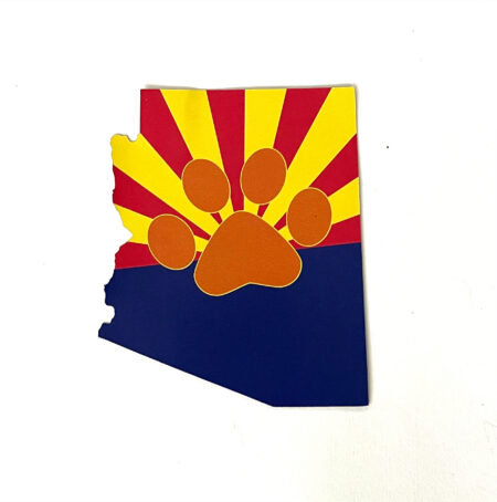 A sticker of the state of arizona with a paw print.