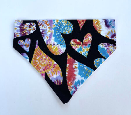 A colorful bandana with black letters and hearts.