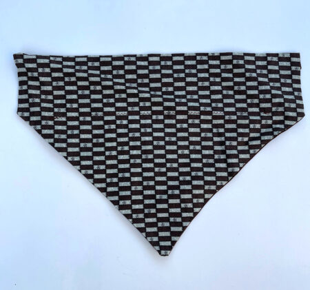 A black and white pattern is on the dog bandana.