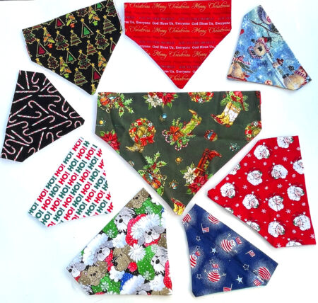 A group of christmas themed bandanas on top of each other.