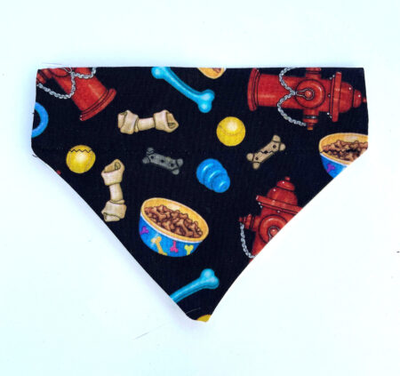 A black bandana with various dog treats and bones.