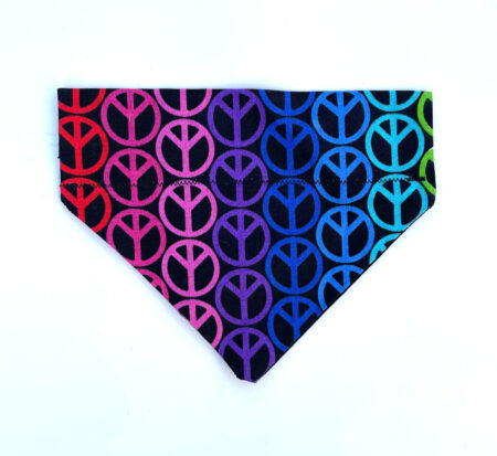 A colorful bandana with peace signs on it.