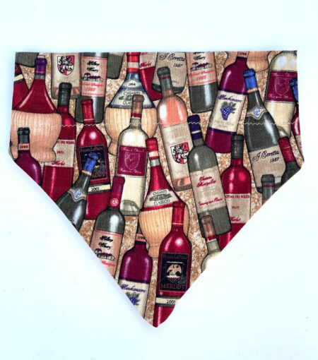 A dog bandana with bottles of wine on it.